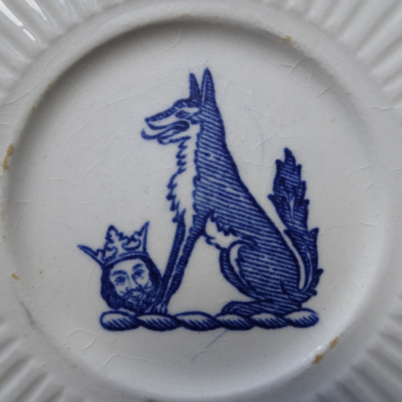 Detail of Wolf and Head Saucer